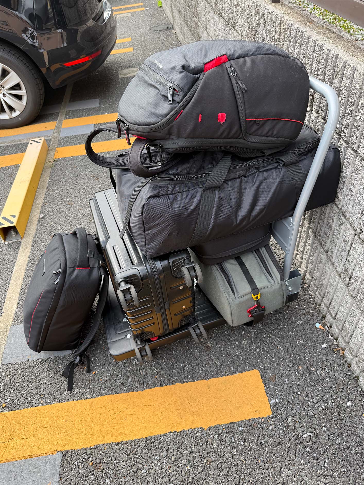 Bags of gear stacked on a cart